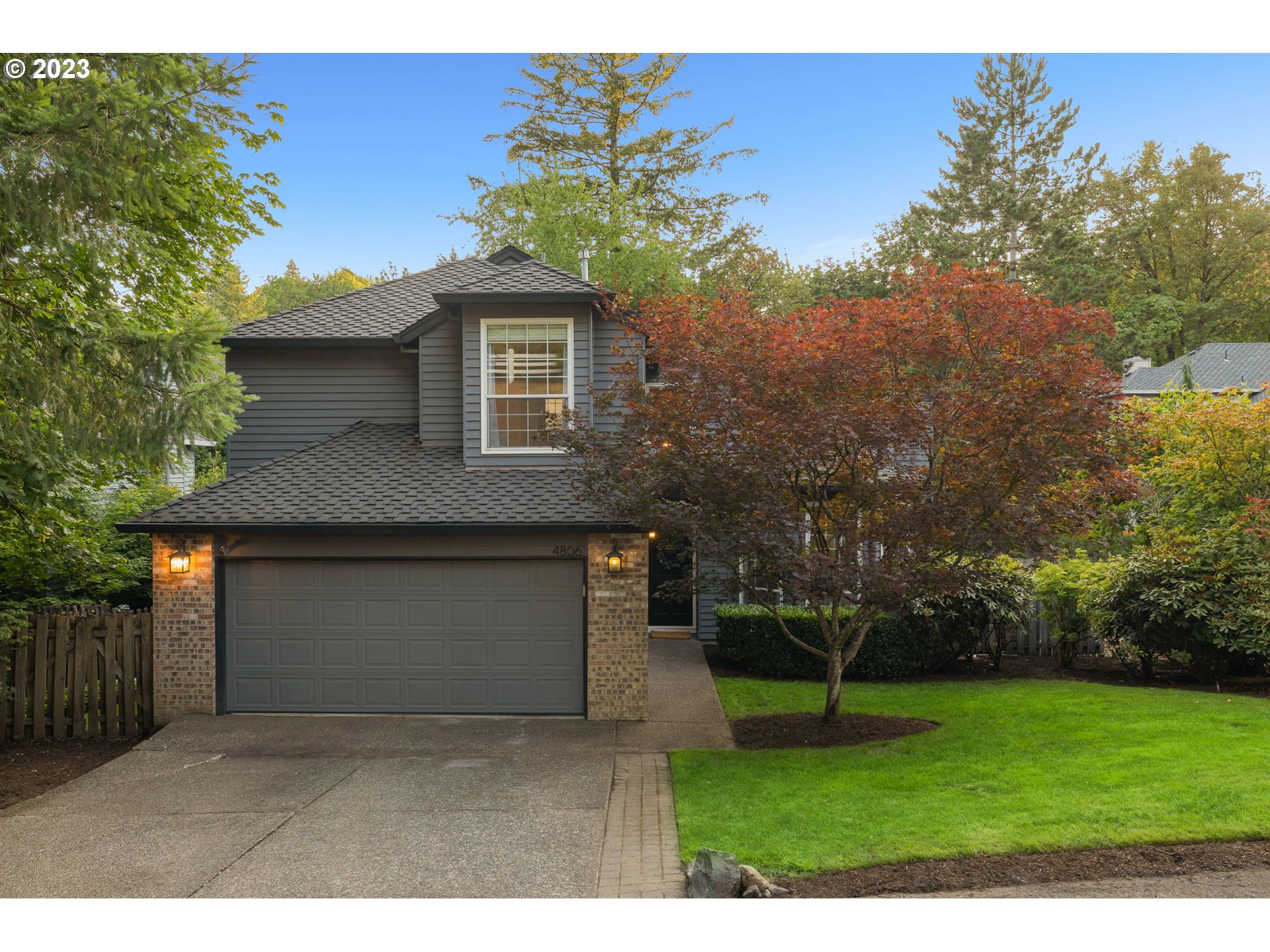 4806 Southwest Orchard Lane Portland, OR 97219 - Photo 35 of 35 a front view of a house with a yard