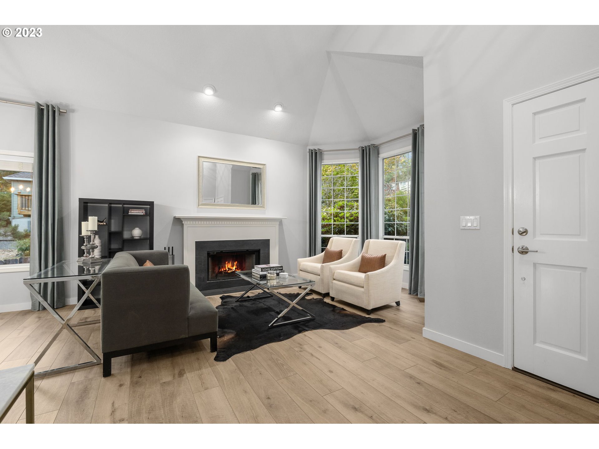 4806 Southwest Orchard Lane Portland, OR 97219 - Photo 6 of 35 a living room with furniture and a fireplace