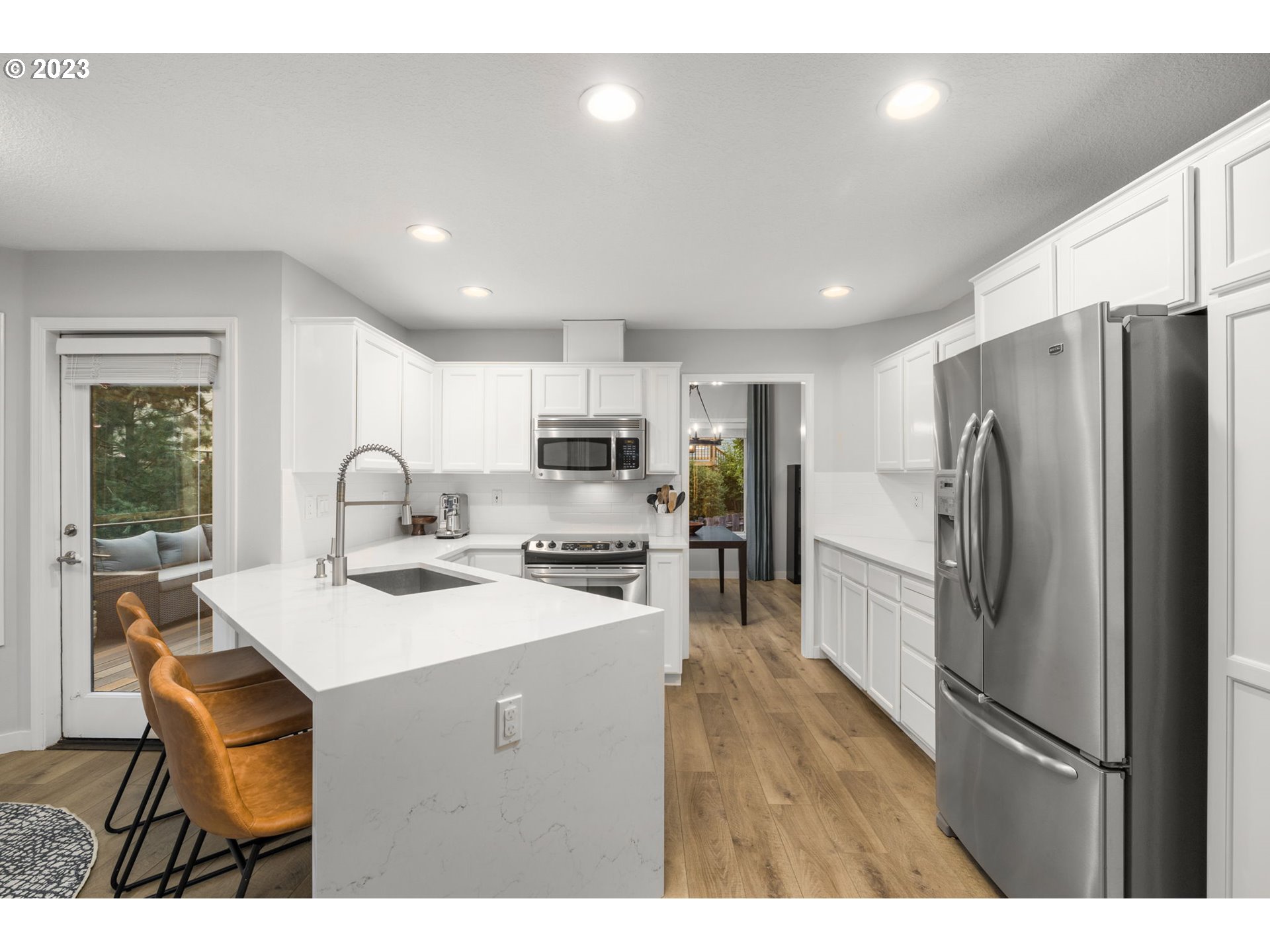 4806 Southwest Orchard Lane Portland, OR 97219 - Photo 7 of 35 a kitchen with refrigerator and a sink