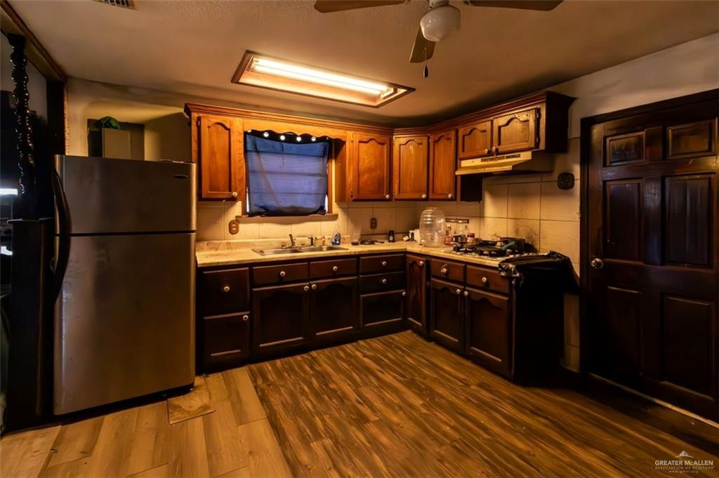 733 East Earling Road San Juan, TX 78589 - Photo 11 of 19 a kitchen with a refrigerator and a stove
