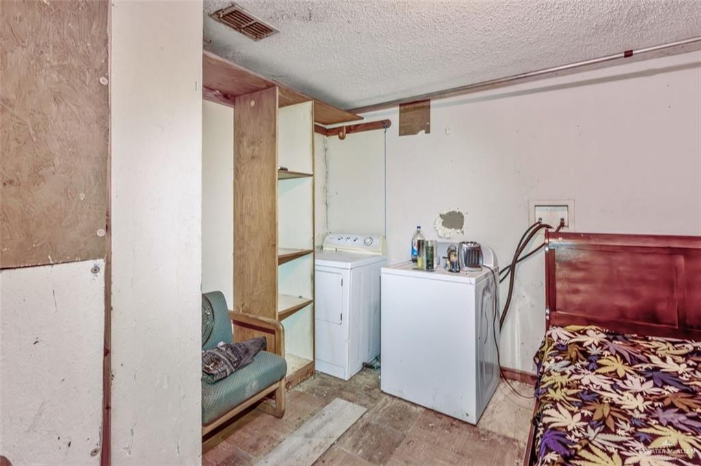 733 East Earling Road San Juan, TX 78589 - Photo 18 of 19 a room with storage and utility