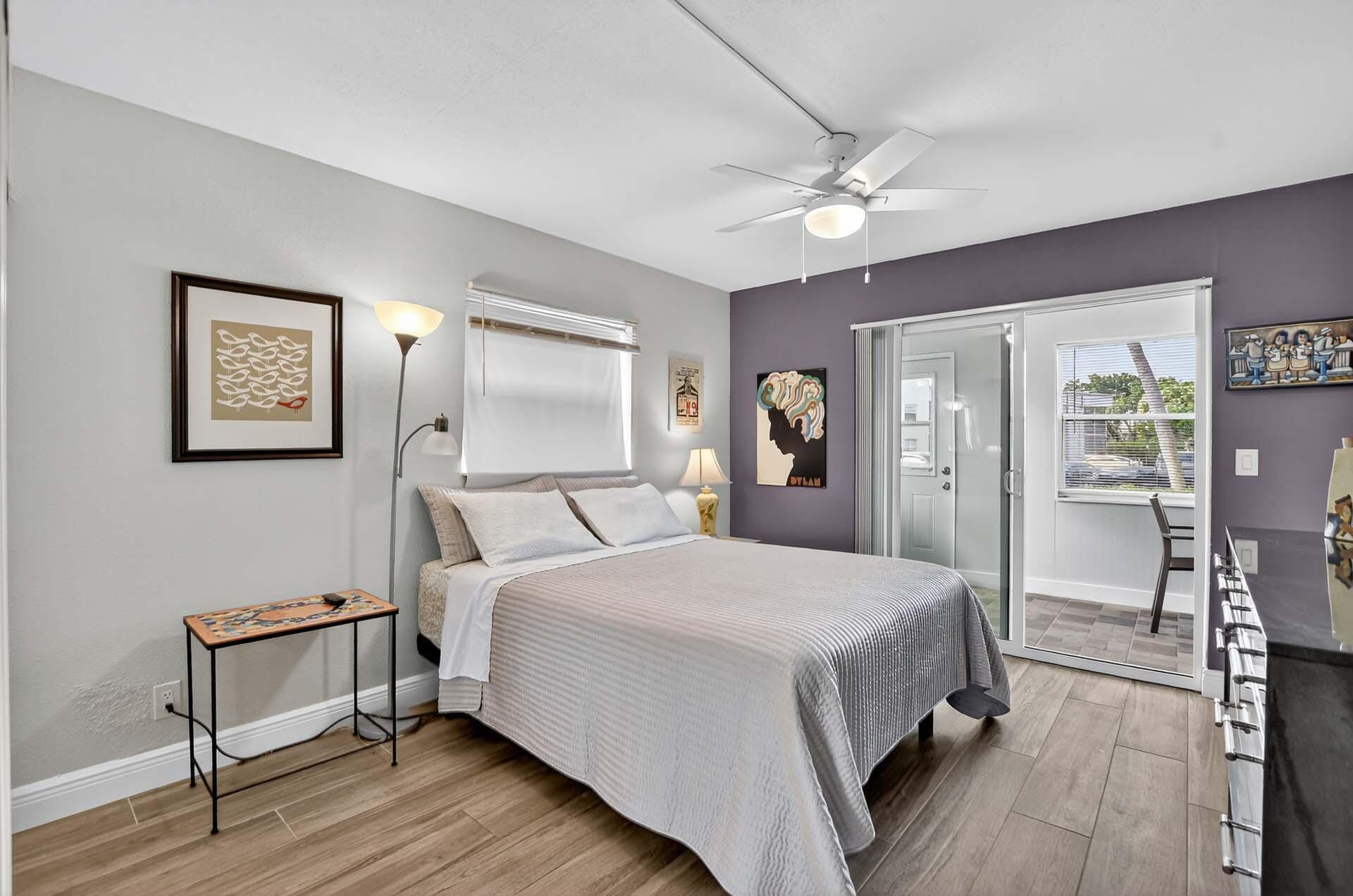 360 Flanders Drive, Unit H Delray Beach, FL 33484 - Photo 14 of 65 a spacious bedroom with a bed and a table