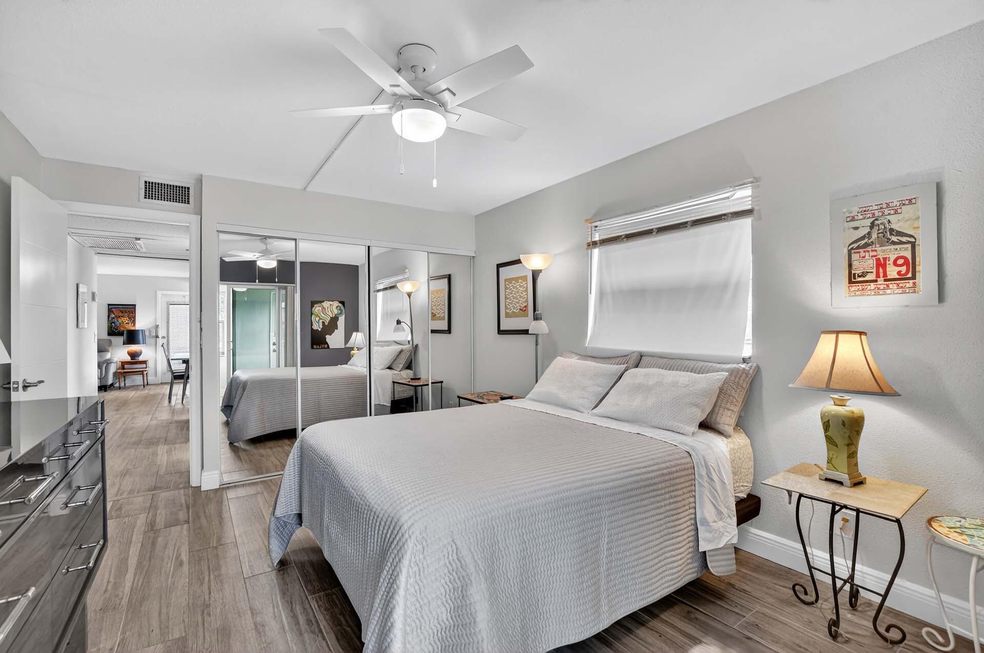 360 Flanders Drive, Unit H Delray Beach, FL 33484 - Photo 16 of 65 a bedroom with a bed and wooden floor