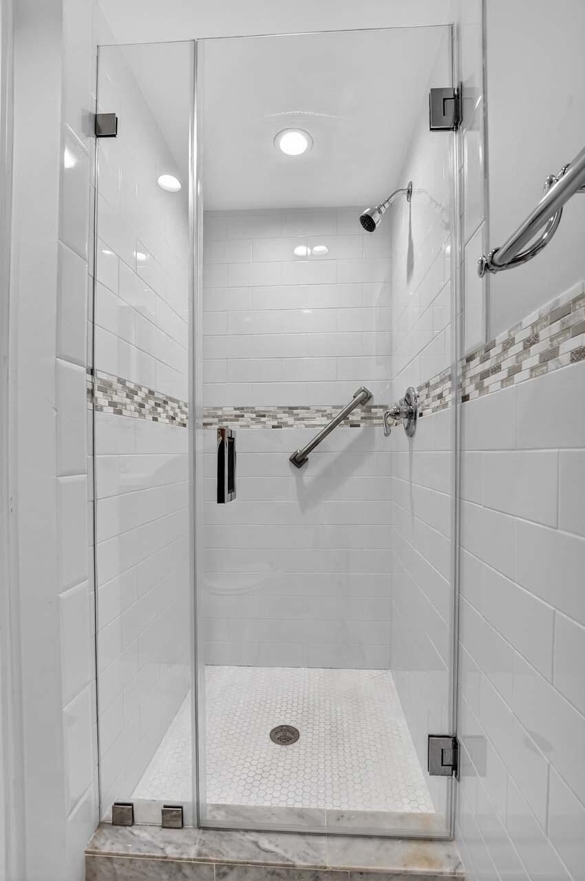 360 Flanders Drive, Unit H Delray Beach, FL 33484 - Photo 18 of 65 a bathroom with a shower