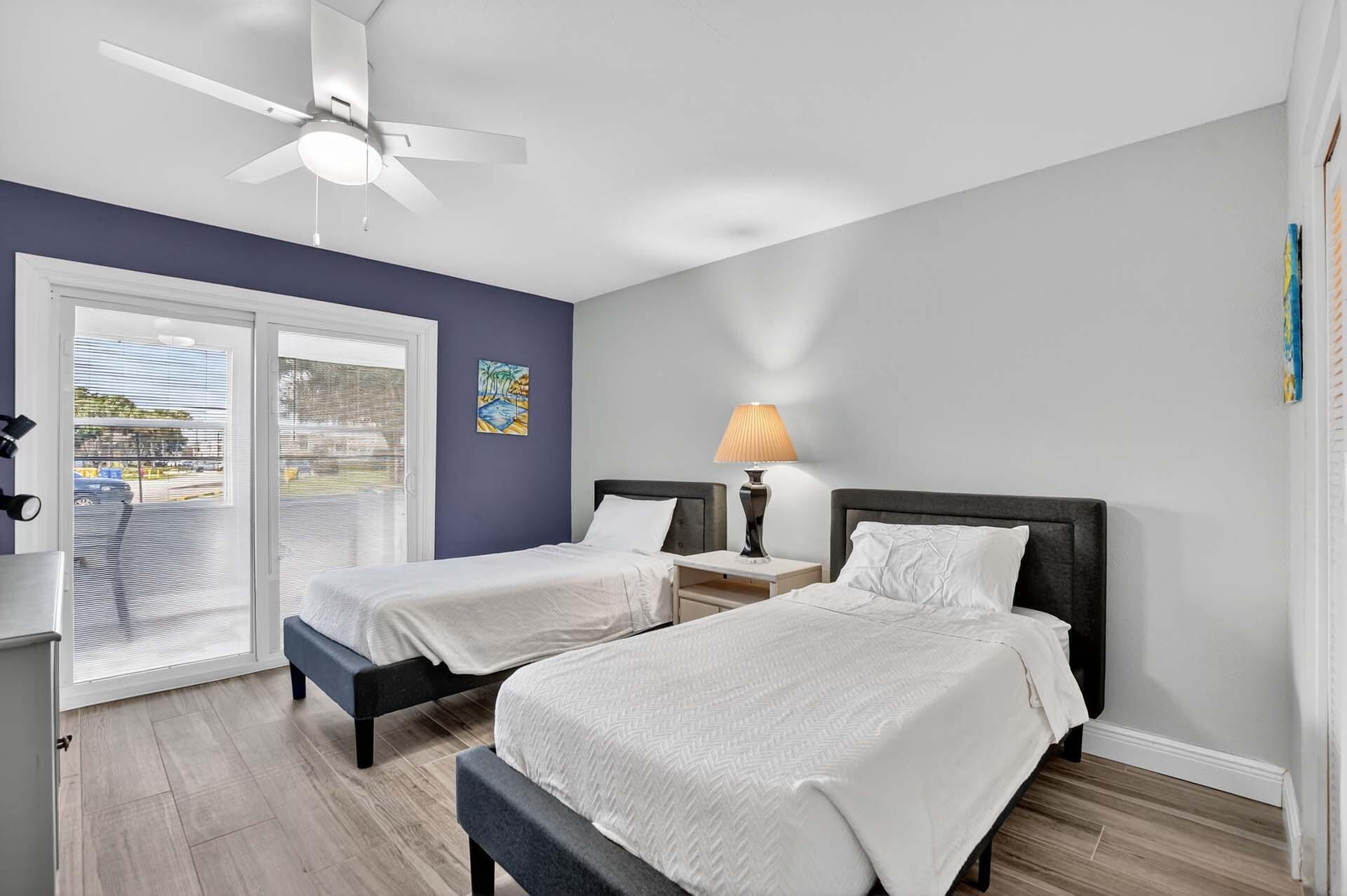 360 Flanders Drive, Unit H Delray Beach, FL 33484 - Photo 19 of 65 a bedroom with two beds and large window