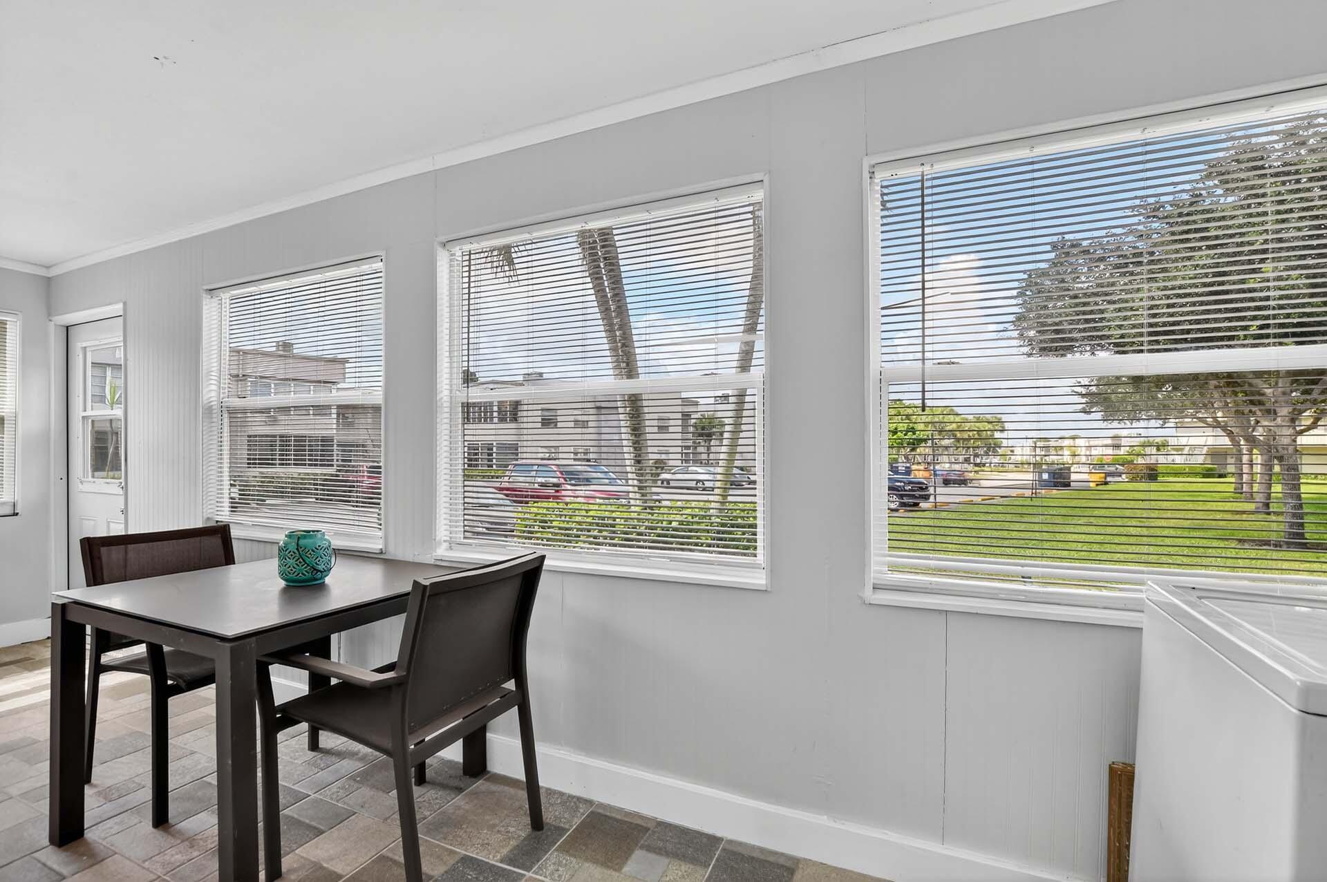 360 Flanders Drive, Unit H Delray Beach, FL 33484 - Photo 23 of 65 a workspace with furniture and a window