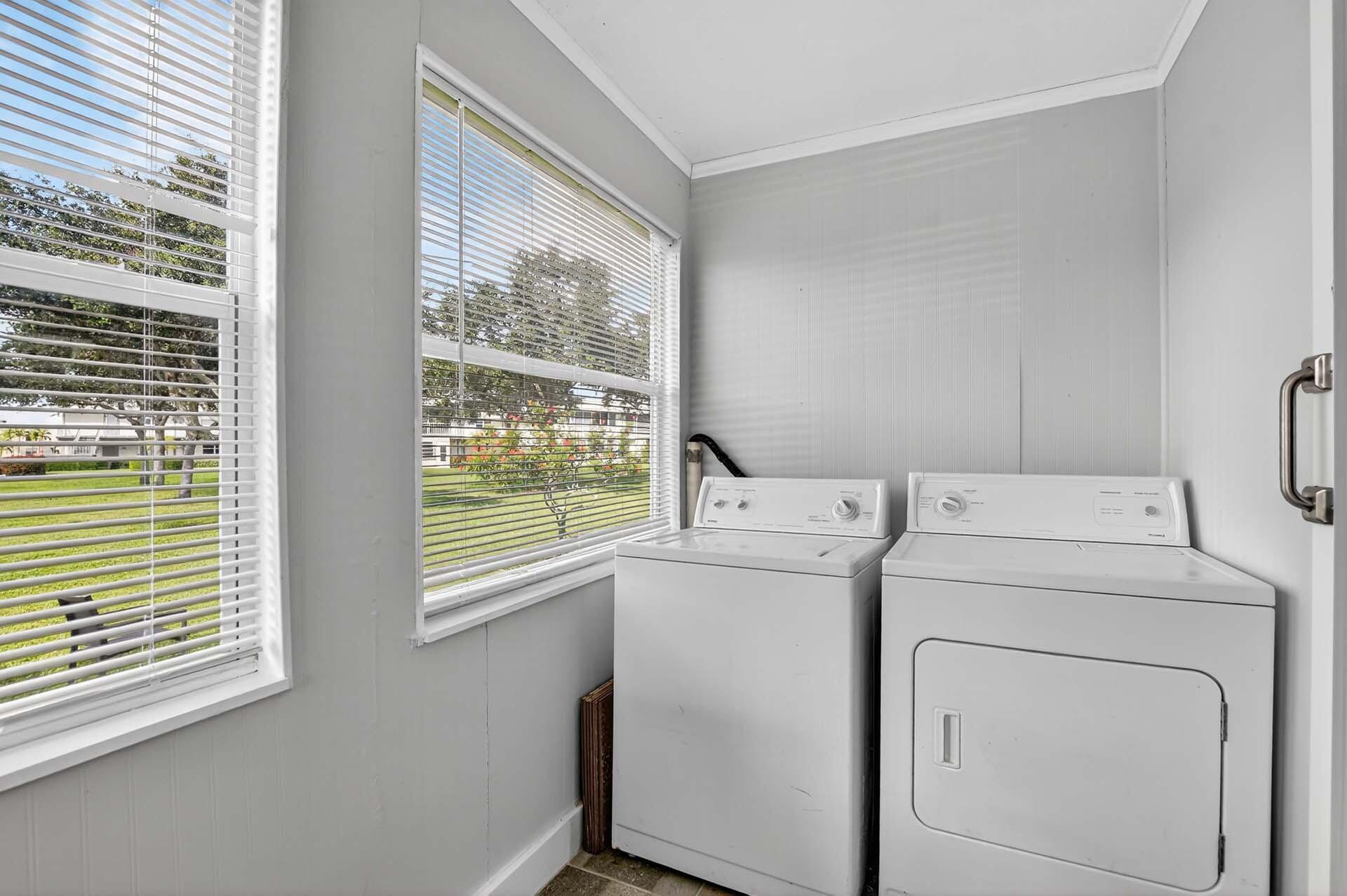 360 Flanders Drive, Unit H Delray Beach, FL 33484 - Photo 24 of 65 a utility room with dryer and washer
