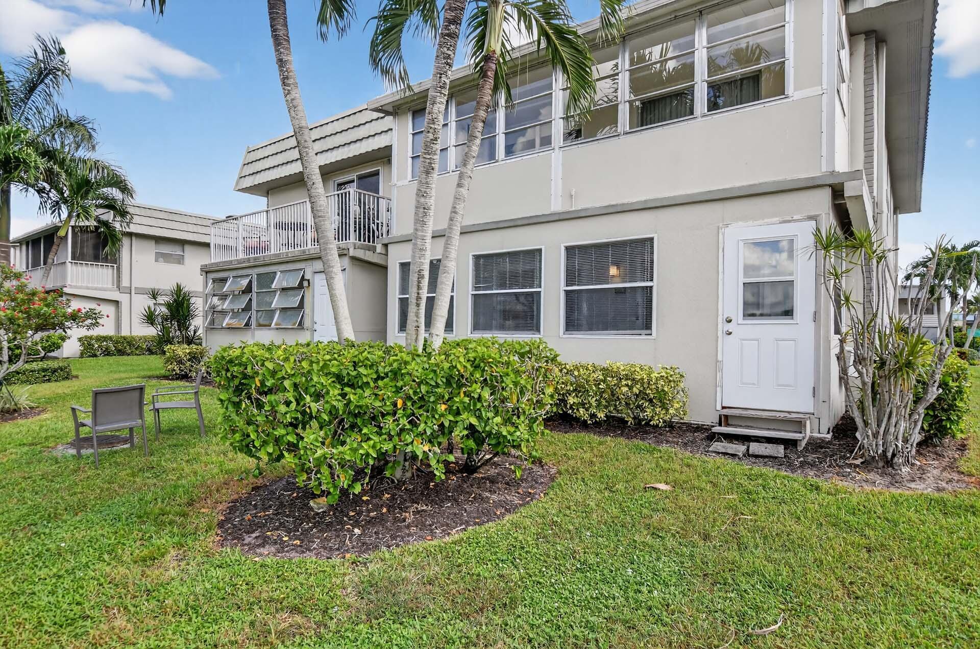 360 Flanders Drive, Unit H Delray Beach, FL 33484 - Photo 25 of 65 a view of a house with a yard and plants