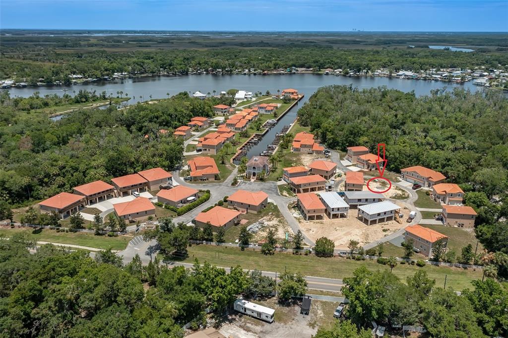 10234 West Middleburg Loop, Unit 152 Homosassa, FL 34448 - Photo 1 of 28 an aerial view of residential houses with outdoor space and river