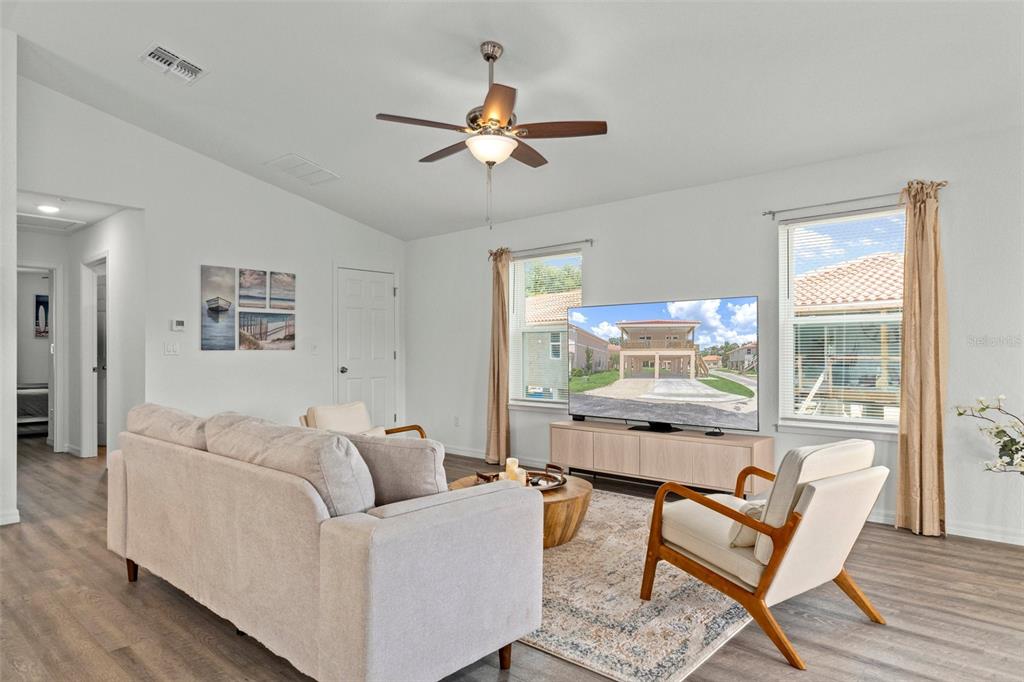10234 West Middleburg Loop, Unit 152 Homosassa, FL 34448 - Photo 13 of 28 a living room with furniture and a large window