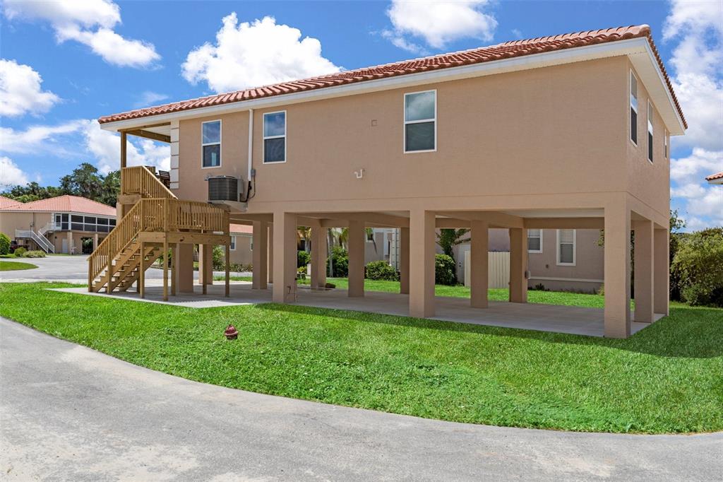 10234 West Middleburg Loop, Unit 152 Homosassa, FL 34448 - Photo 21 of 28 a front view of house with yard and green space