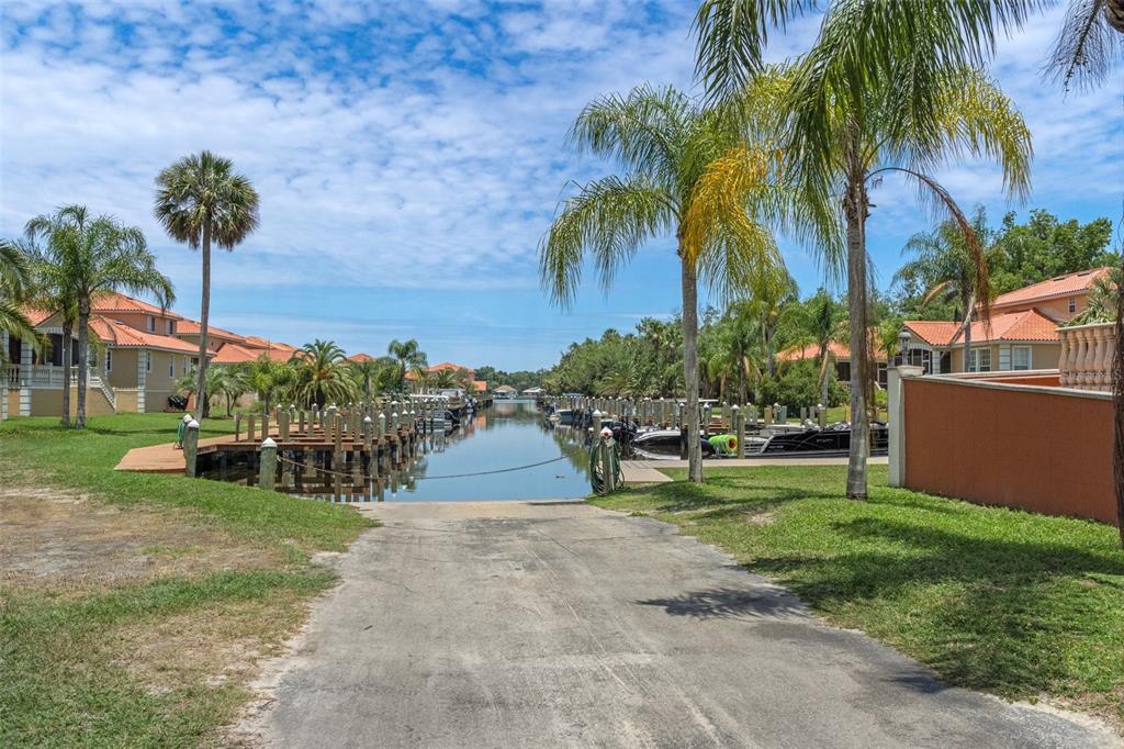 10234 West Middleburg Loop, Unit 152 Homosassa, FL 34448 - Photo 24 of 28 a view of a park with plants and palm trees
