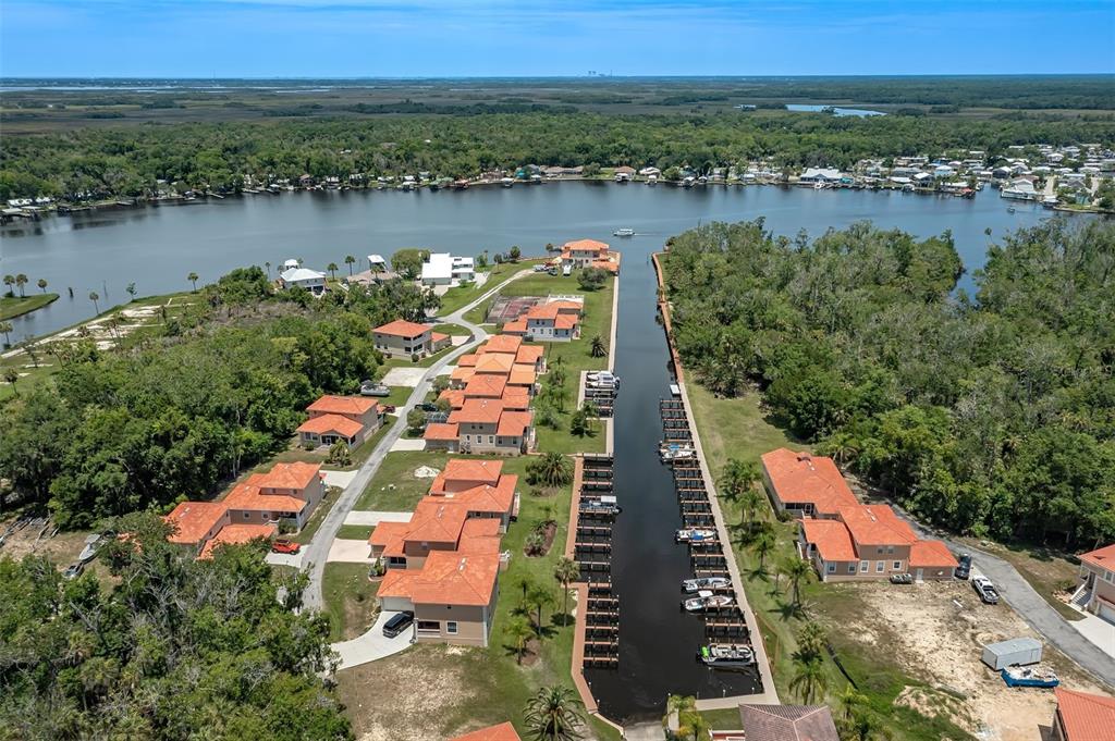 10234 West Middleburg Loop, Unit 152 Homosassa, FL 34448 - Photo 27 of 28 an aerial view of residential houses with outdoor space and lake view