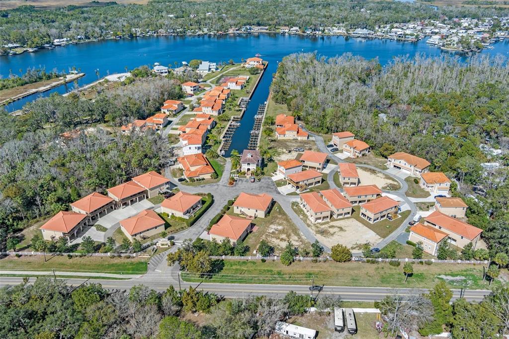 10234 West Middleburg Loop, Unit 152 Homosassa, FL 34448 - Photo 28 of 28 an aerial view of residential house with outdoor space and lake view