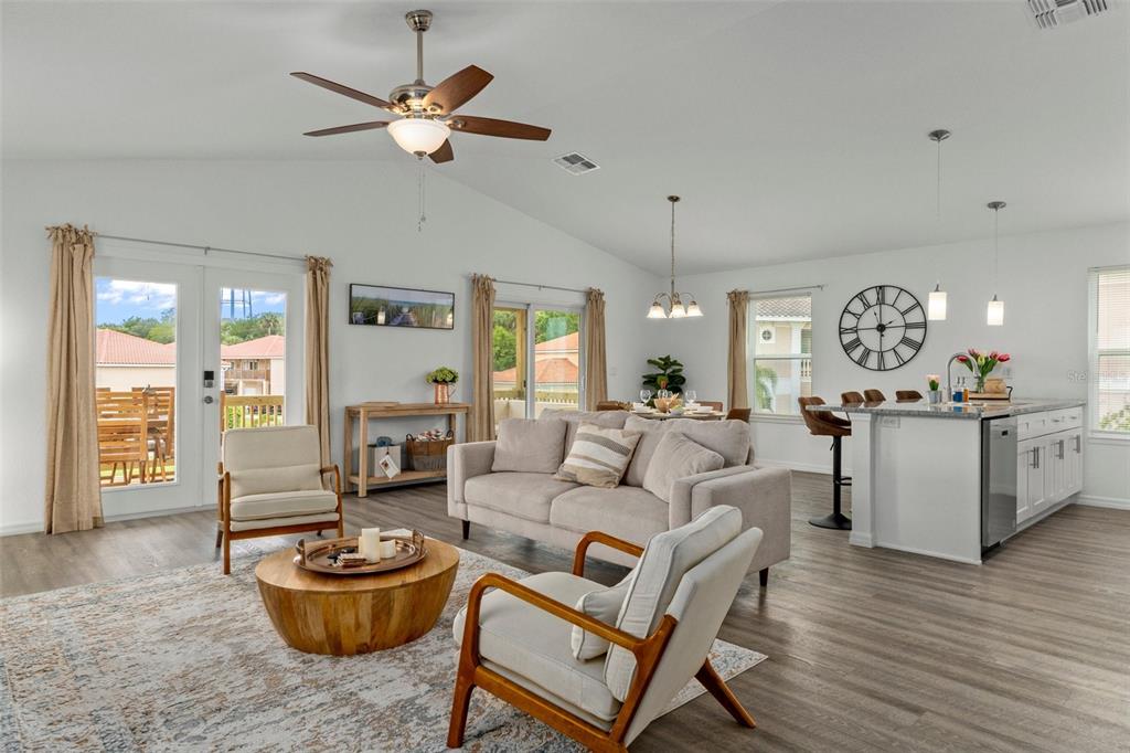 10234 West Middleburg Loop, Unit 152 Homosassa, FL 34448 - Photo 5 of 28 a living room with furniture and a wooden floor