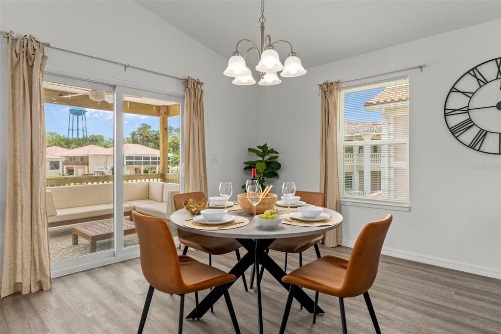 10234 West Middleburg Loop, Unit 152 Homosassa, FL 34448 - Photo 7 of 28 a view of a dining room with furniture window and wooden floor