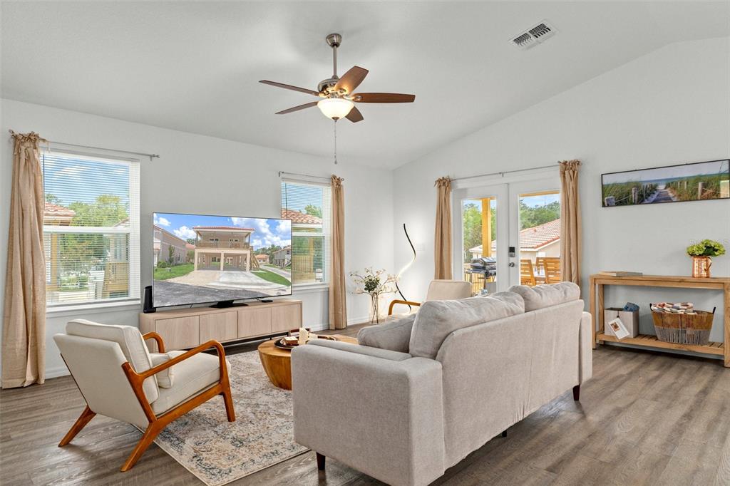 10234 West Middleburg Loop, Unit 152 Homosassa, FL 34448 - Photo 9 of 28 a living room with furniture and a window
