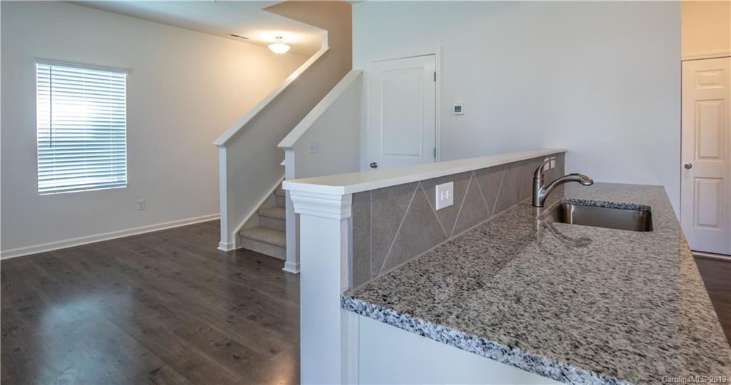 12532 Gotland Road, Unit 331 Midland, NC 28107 - Photo 16 of 26 a view of staircase and kitchen with sink