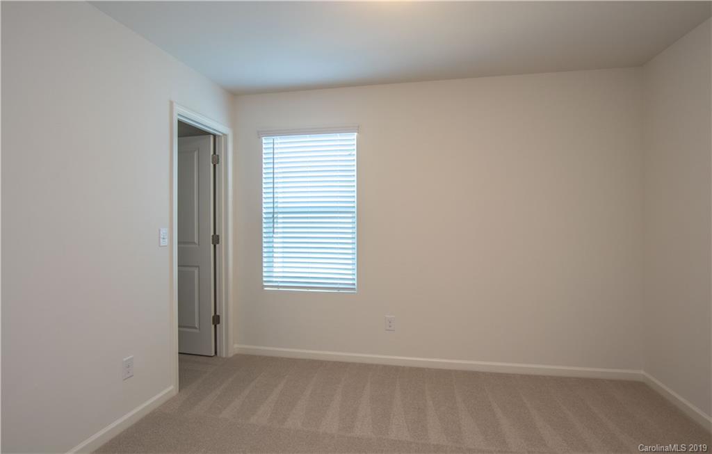 12532 Gotland Road, Unit 331 Midland, NC 28107 - Photo 21 of 26 a view of an empty room with a window