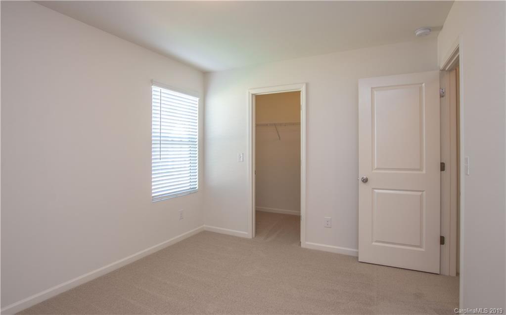 12532 Gotland Road, Unit 331 Midland, NC 28107 - Photo 22 of 26 a view of an empty room with a window