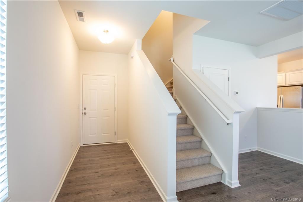 12532 Gotland Road, Unit 331 Midland, NC 28107 - Photo 4 of 26 a view of a hallway with staircase