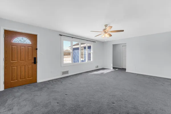 a view of an empty room with a window