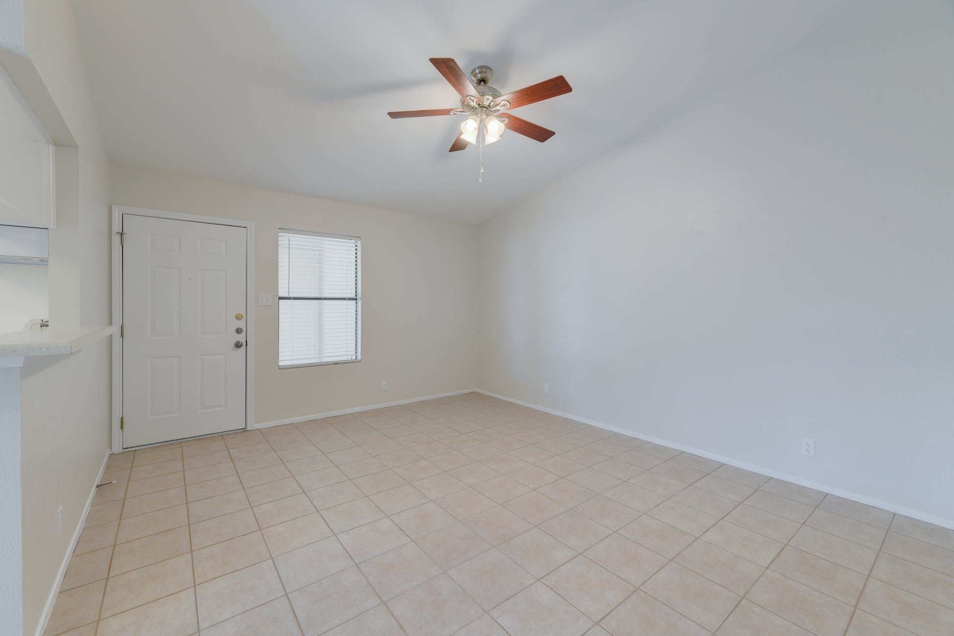 12603 Teague Trail, Unit B Austin, TX 78729 - Photo 5 of 14 an empty room with closet and windows