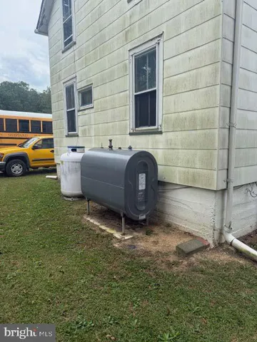 a view of a backyard with table and chairs
