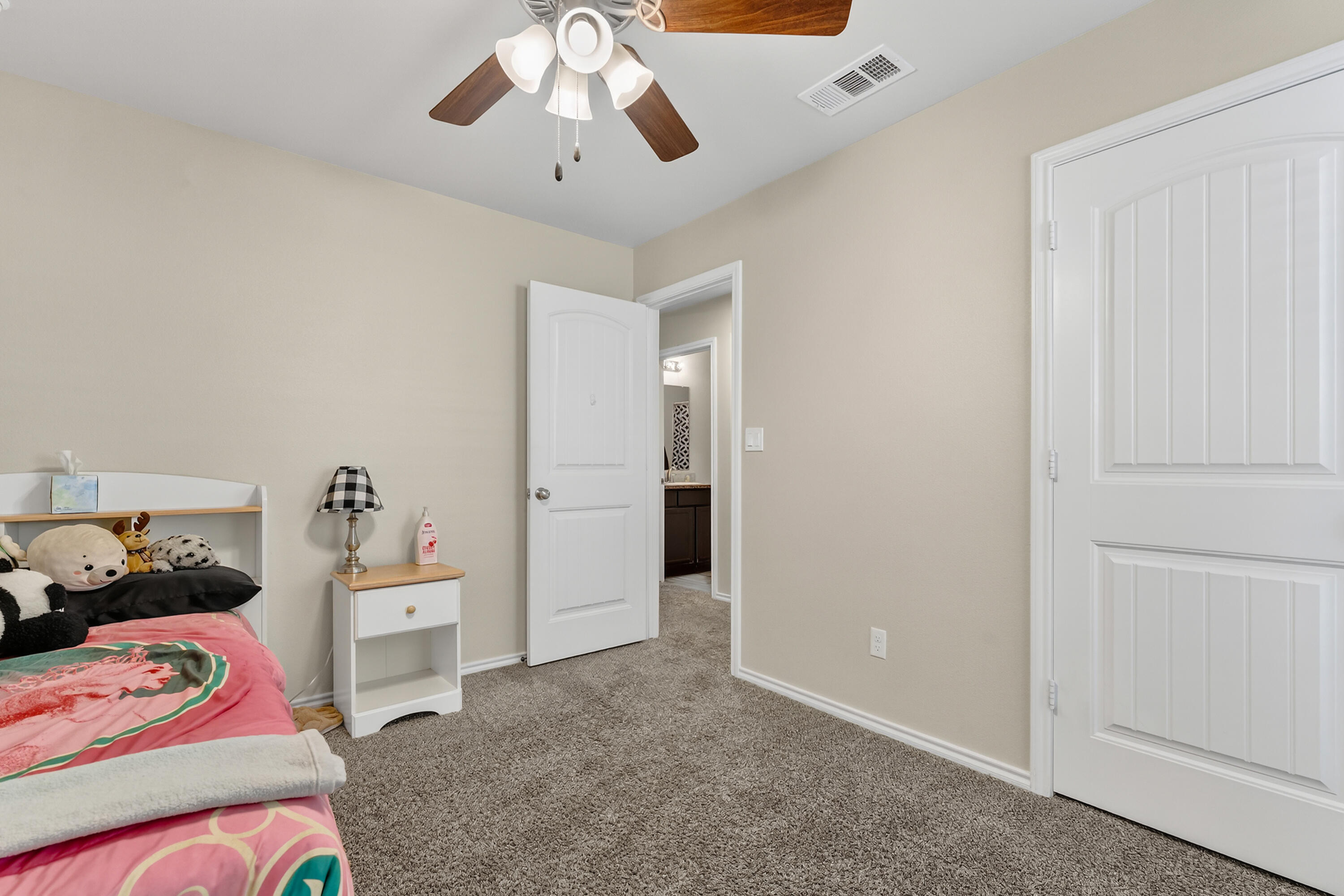 7402 105th Street Lubbock, TX 79424 - Photo 18 of 22 a bedroom with furniture and a window