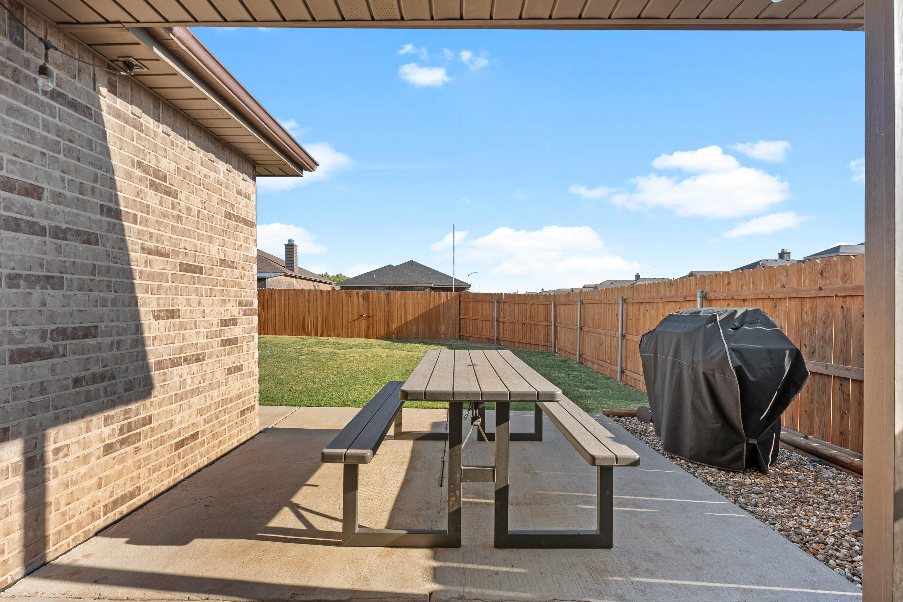 7402 105th Street Lubbock, TX 79424 - Photo 19 of 22 a view of a balcony with furniture and wooden floor