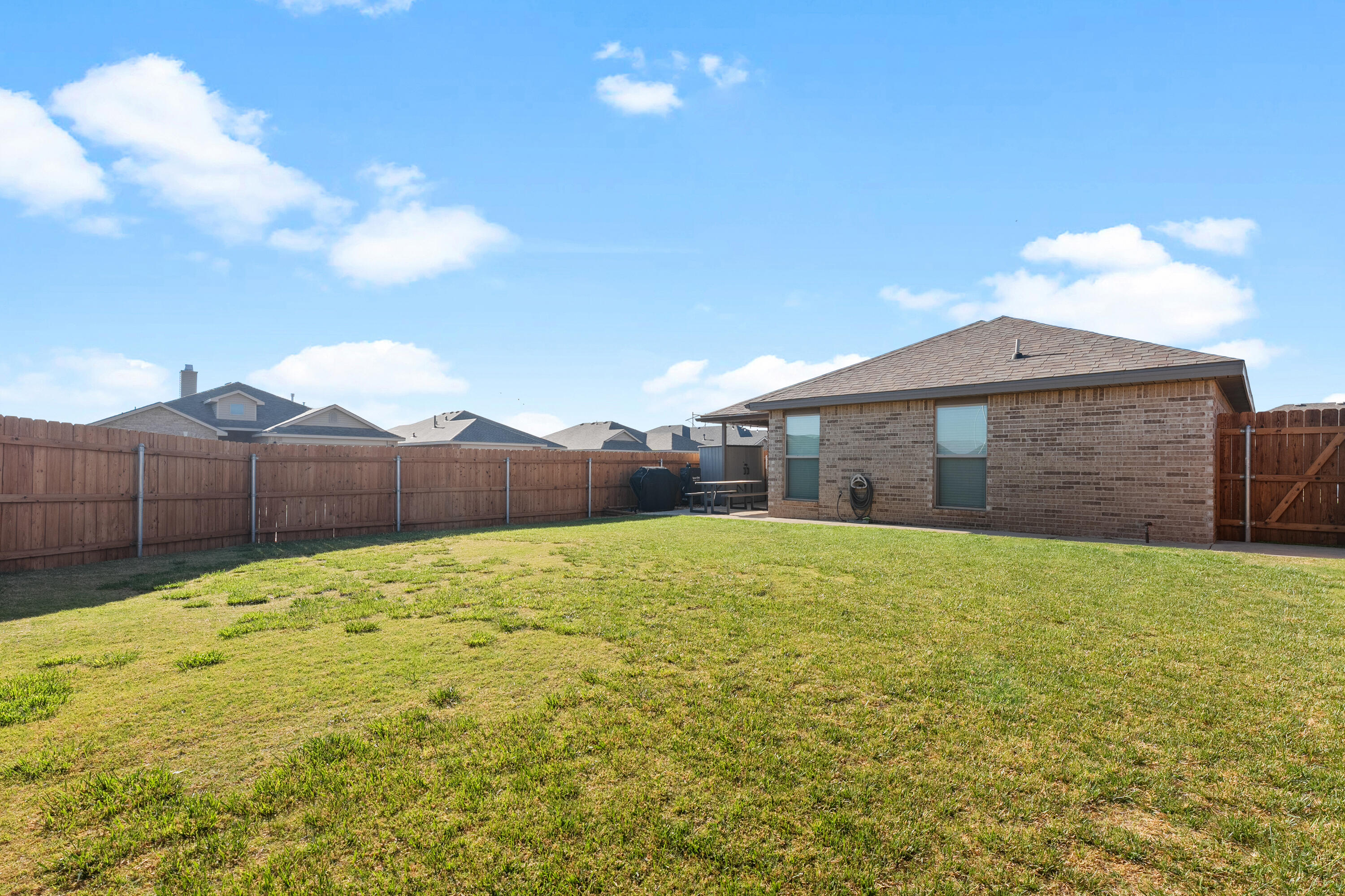 7402 105th Street Lubbock, TX 79424 - Photo 21 of 22 a backyard of a house