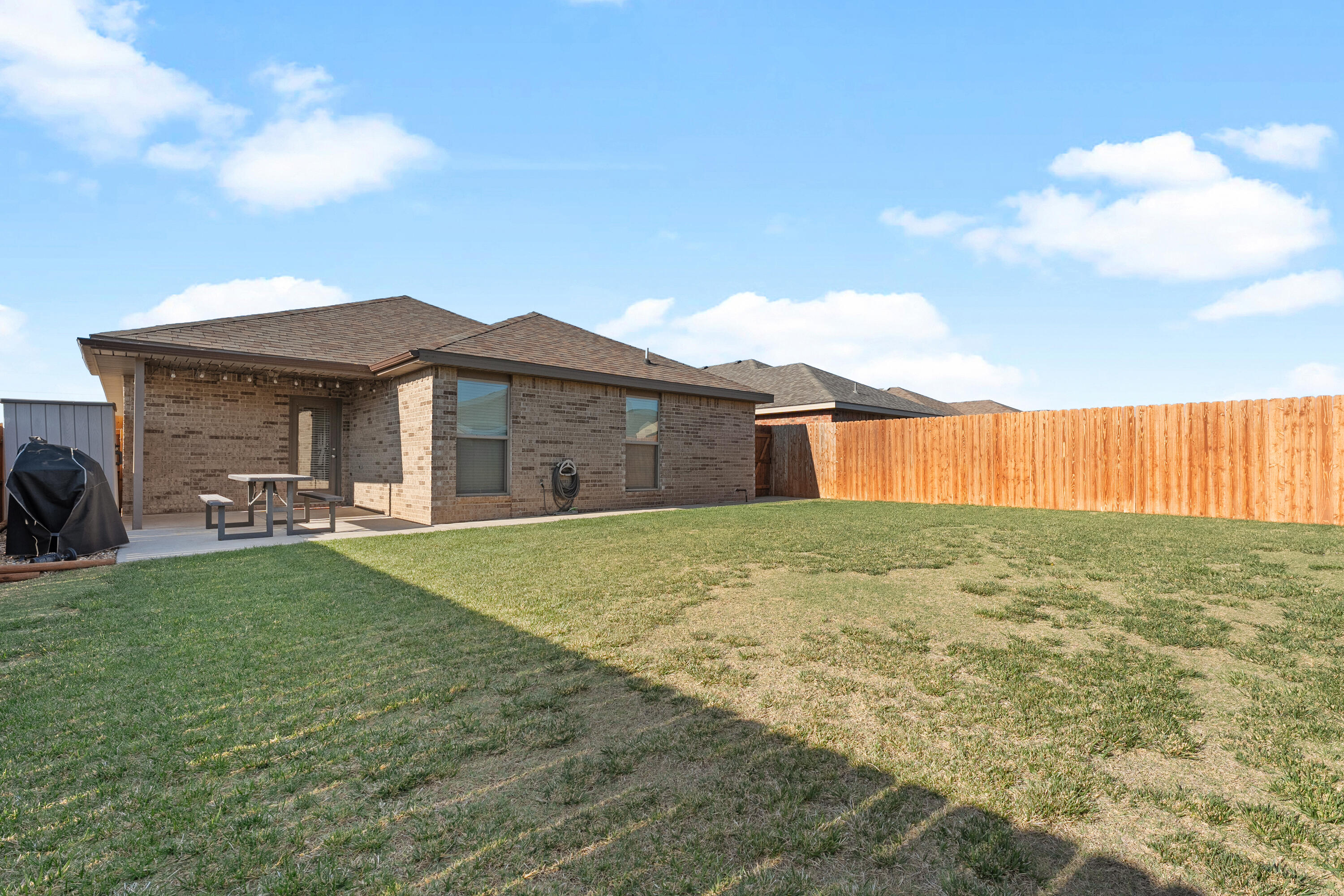 7402 105th Street Lubbock, TX 79424 - Photo 22 of 22 a view of a house with backyard and garden