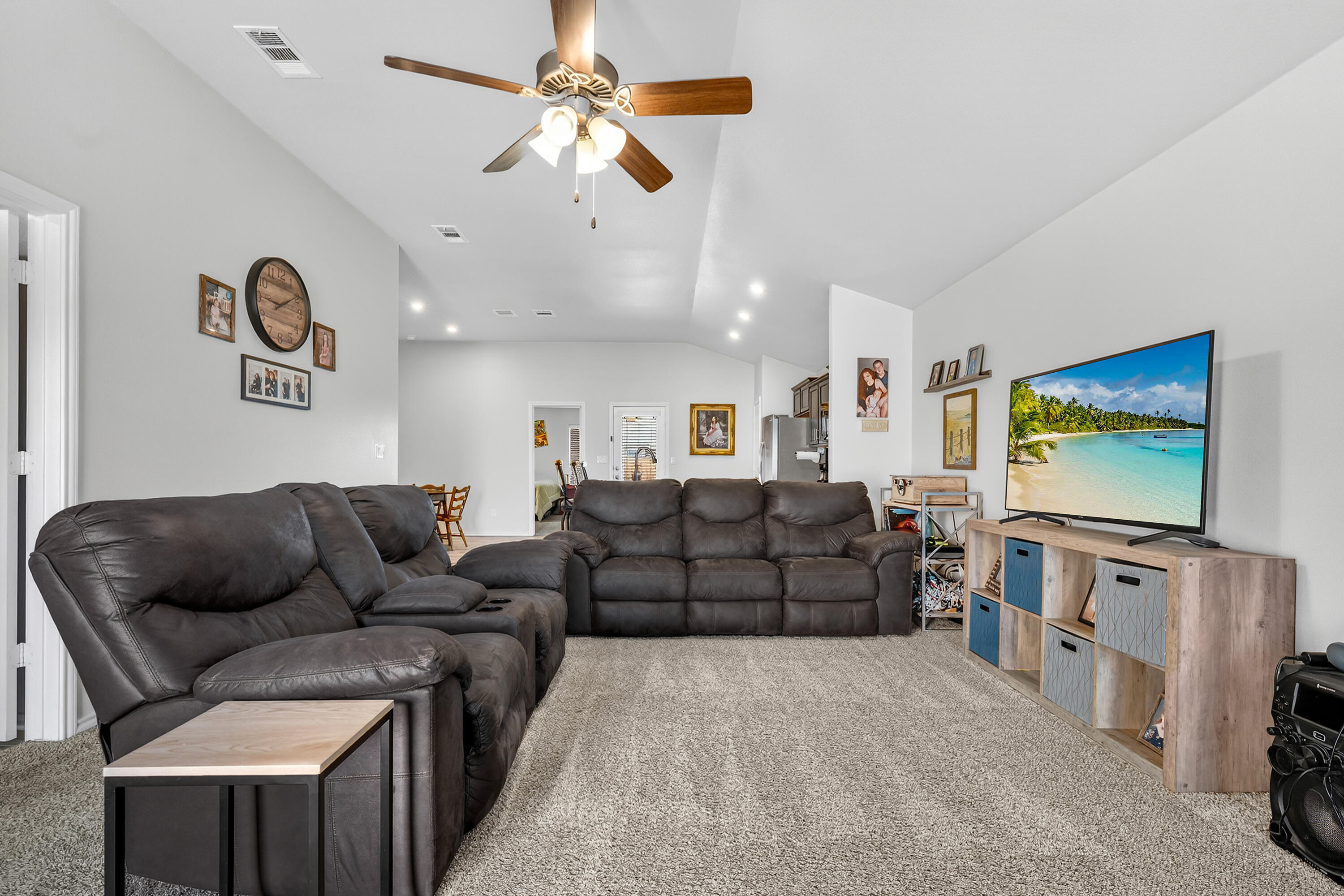 7402 105th Street Lubbock, TX 79424 - Photo 3 of 22 a living room with furniture and a flat screen tv