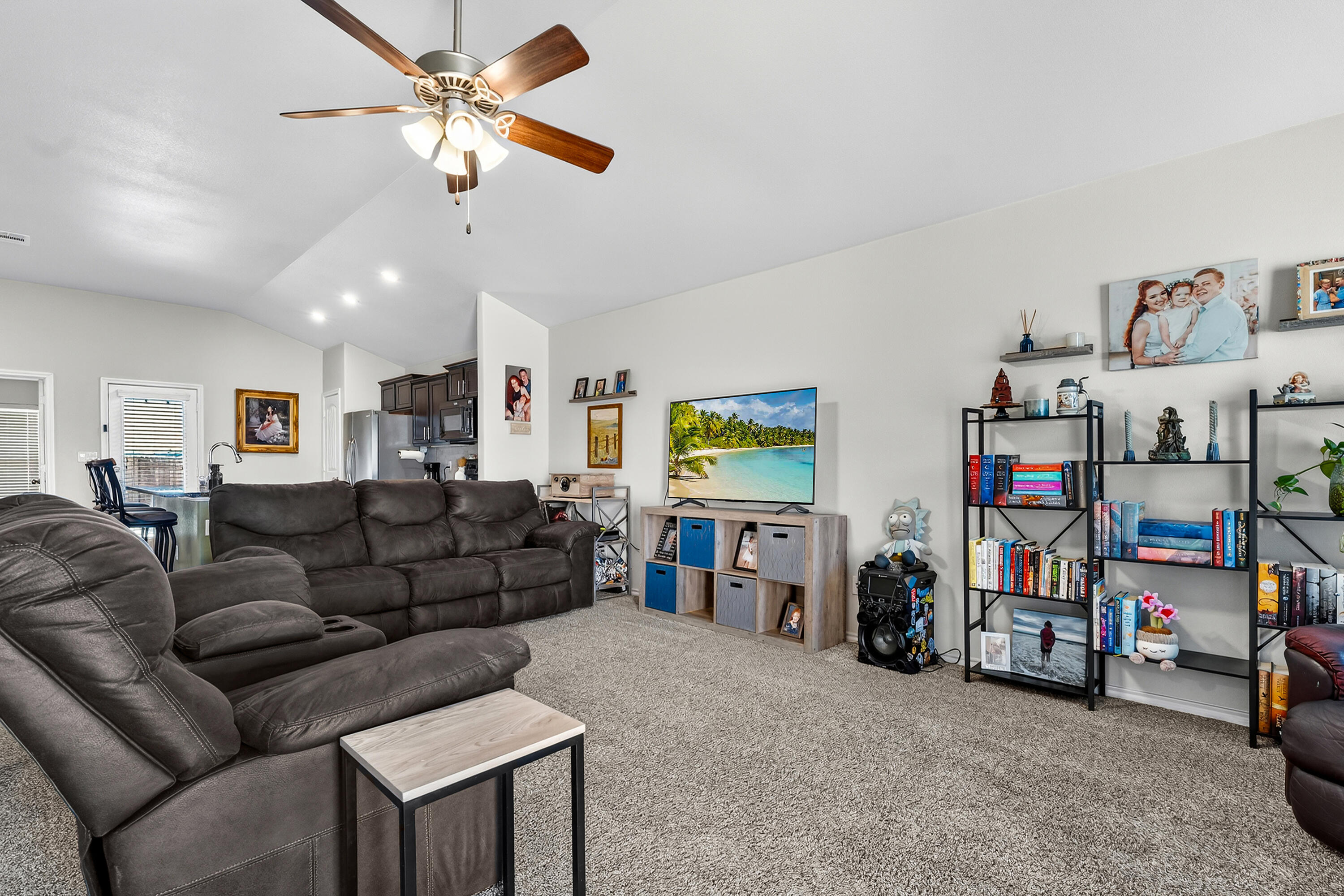 7402 105th Street Lubbock, TX 79424 - Photo 4 of 22 a living room with lots of furniture and a flat screen tv