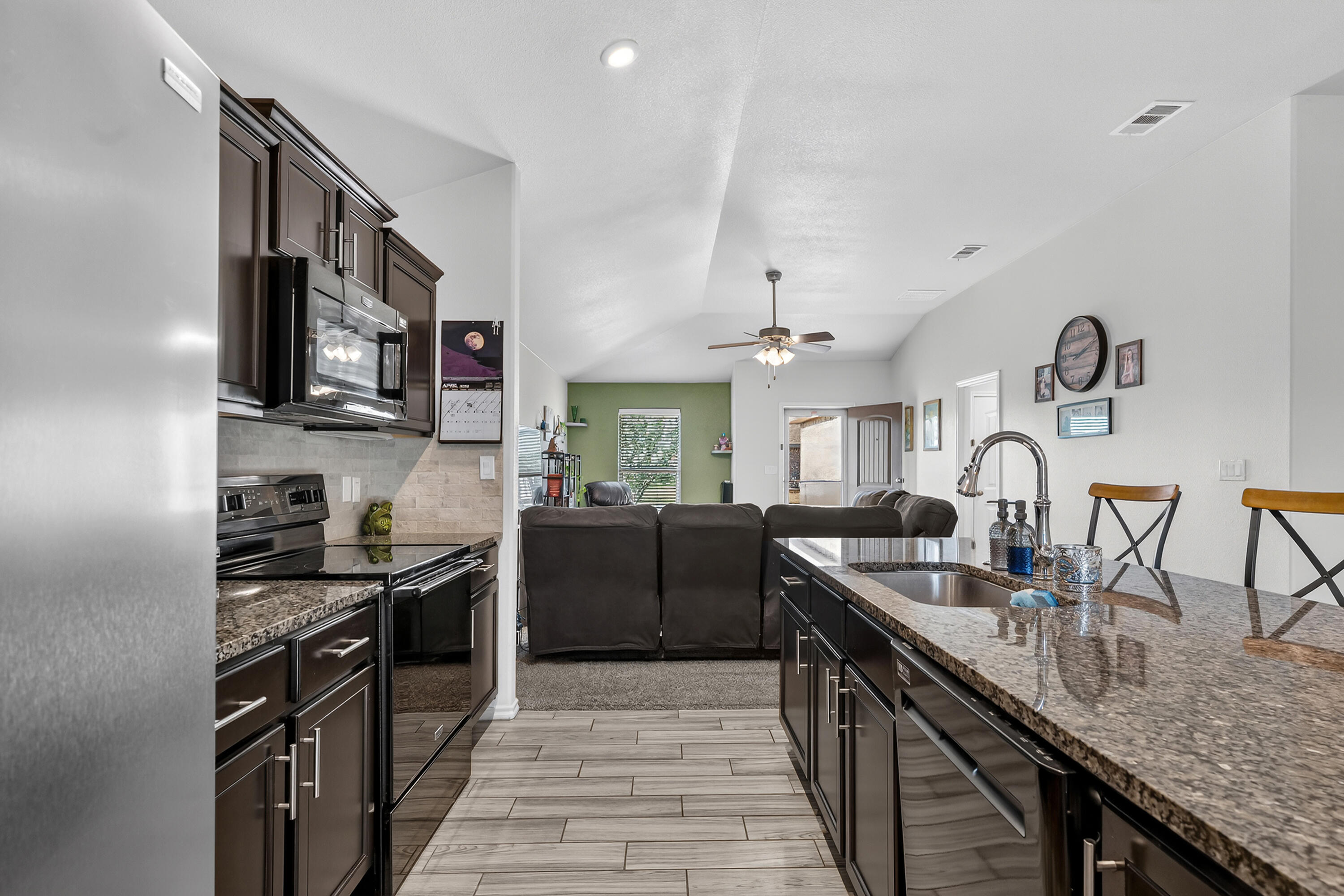 7402 105th Street Lubbock, TX 79424 - Photo 8 of 22 a kitchen with granite countertop stainless steel appliances lots of counter top space