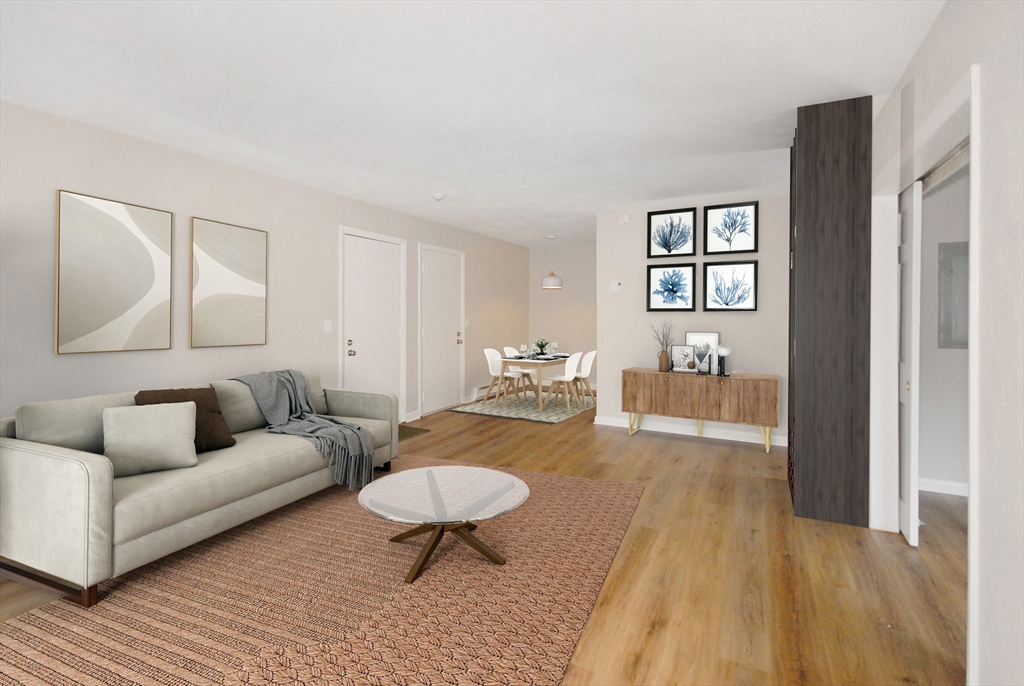 188 Swanson Road, Unit 330 Boxborough, MA 01719 - Photo 1 of 18 a living room with furniture and a wooden floor