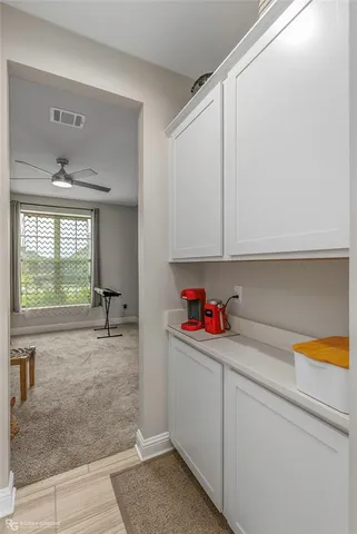 a kitchen with a sink cabinets and appliances