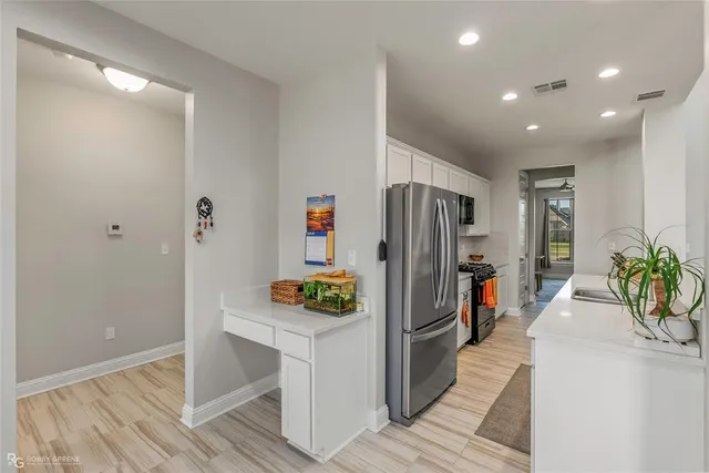 a bedroom with a large bed and a large window