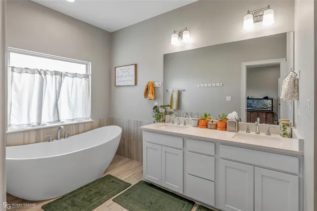 a bathroom with a toilet and a bathtub