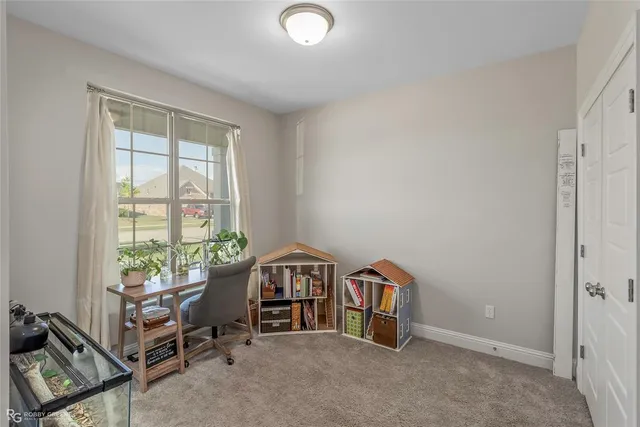 a bed room with a bed and a lamp