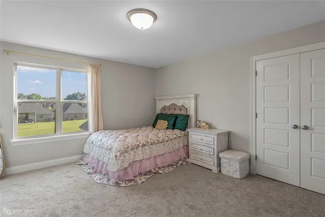 a bedroom with a bed and a cabinets