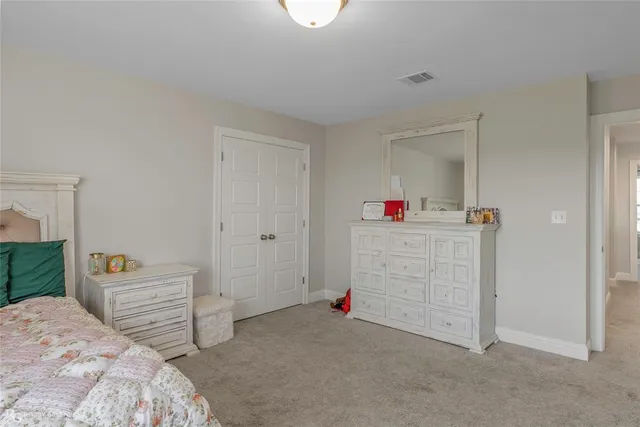 a spacious bathroom with a double vanity sink and a mirror