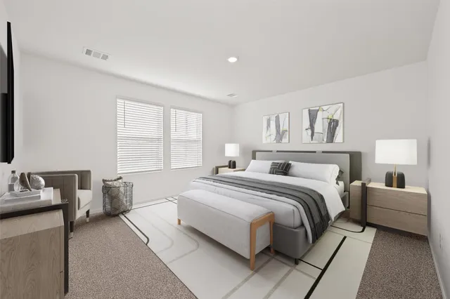 a bedroom with a bed and a couch