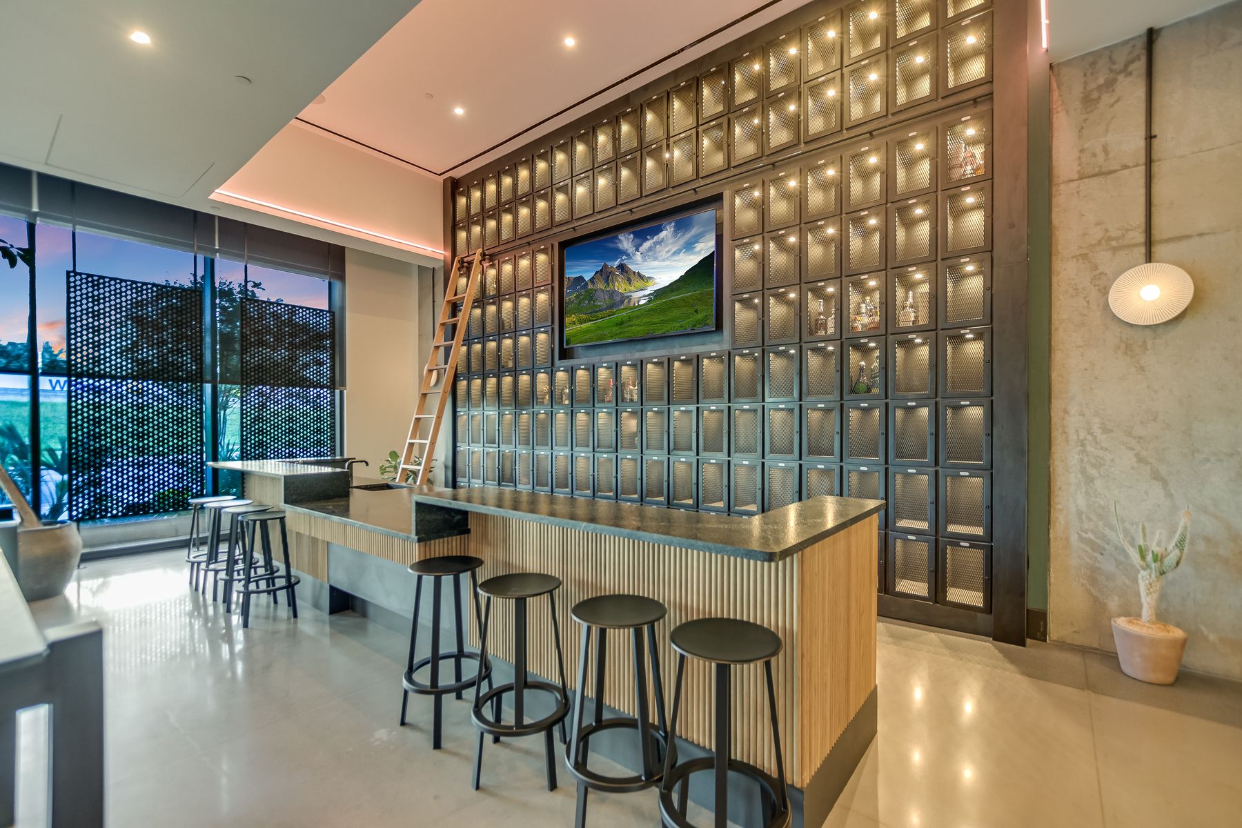 84 East Avenue, Unit 3909 Austin, TX 78701 - Photo 13 of 26 Indoor wet bar featuring expansive windows, dark countertops, and glass insert cabinets