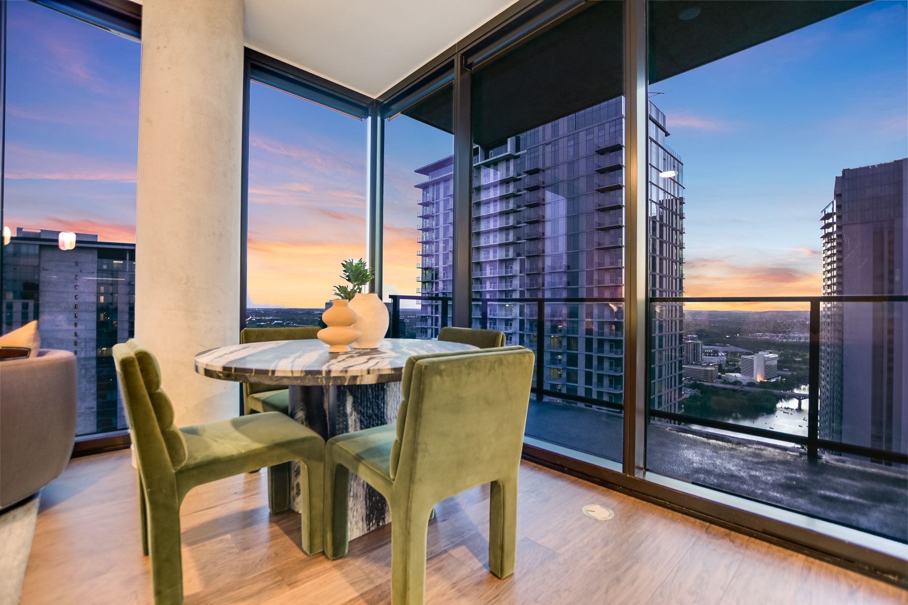 84 East Avenue, Unit 3909 Austin, TX 78701 - Photo 5 of 26 Dining room with a city view, wood finished floors, and expansive windows