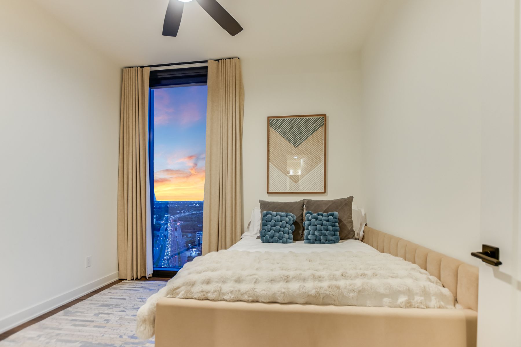 84 East Avenue, Unit 3909 Austin, TX 78701 - Photo 8 of 26 Bedroom with ceiling fan, wood finished floors, and access to exterior