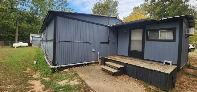 a view of a chairs and table in backyard