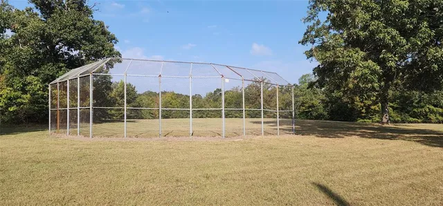 a view of a swimming pool with lounge chairs