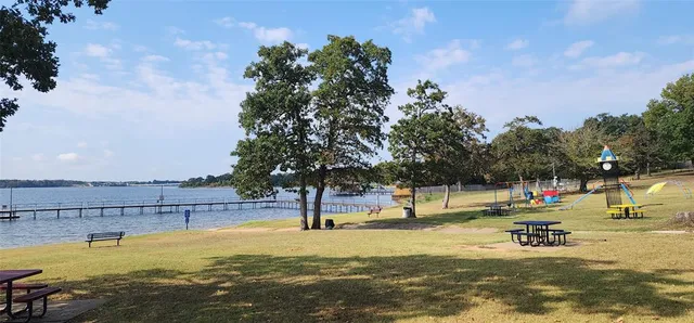 a view of yard with swimming pool and trees