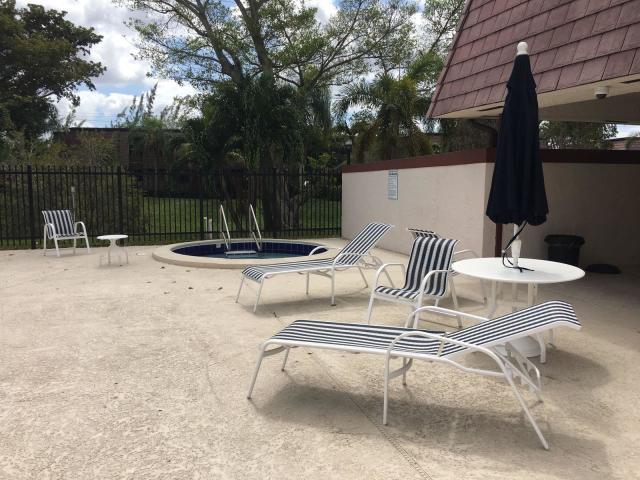 7660 Courtyard Run West Boca Raton, FL 33433 - Photo 11 of 11 a view of table and chairs in patio